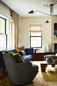 Interior designers in Boston craft an eclectic Brookline home, blending historic architecture, modern furniture, personal art, family heirlooms, and vintage pieces.