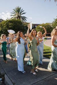 A photo of people cheering after a couple got married
