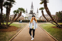 woman stands in front of jackson square church new orleans louisiana