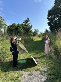 Photographer working with a high school senior during a portrait session in Ann Arbor, capturing natural and stylish senior photos.
