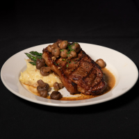 New York striploin steak with drunken mushrooms Max Dales Steak and Chop House Restaurant