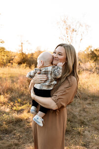 mom holding four month old baby boy