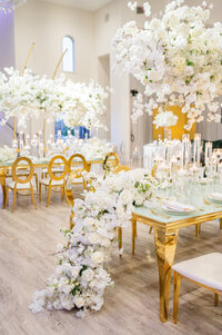 Stunning white floral and gold wedding reception