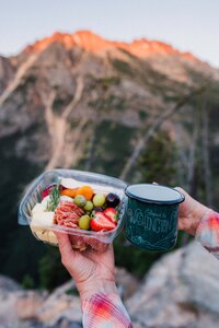 Charcuterie & coffee mug at sunset during a Washington Elopement