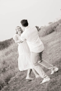 engagement photo of couple laughing