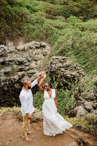 bride and groom dancing cliffside in california