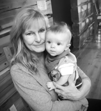 Grandma holding 6mo old baby boy.