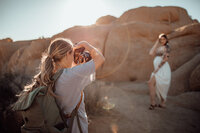 Photographer Michelle Close working at a sunset maternity session. 