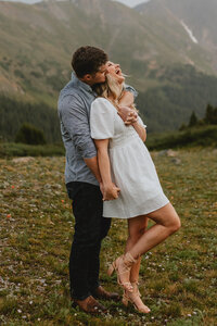 man and woman embrace outdoors