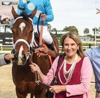 Bonnie Baskin leading Starship Jubilee into the winner's circle.