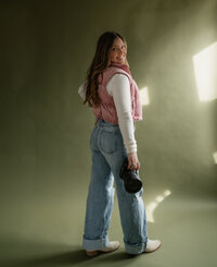 Self-portrait of a Wyoming-based wedding and lifestyle photographer, capturing a professional and artistic shot