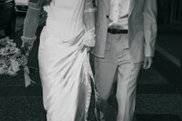 Faceless bride and groom walking representing the artistic nature of the Crush Collective wedding expo.