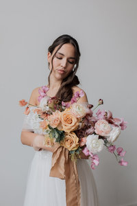 Flower covered arch with bride