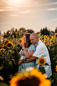 intimate couples session in a sunflower field in upstate ny