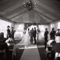 bride and groom taking photos in an elevator at their wedding in boca grande, florida