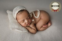 award  from the 2021 AFNS Awards    photography competition badge on the winning newborn photo