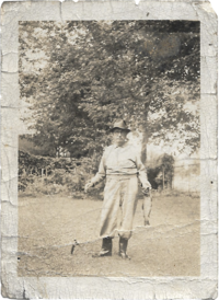 a man holding the fish that he caught in the 1940s. 