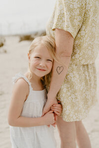 daughter holding mom's hand