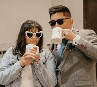 Just married couple at Junior League in Bakersfield, CA, celebrating with coffee mugs.