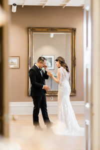 Groom crying beside bride after seeing his bride for the first time on their wedding day.