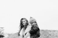 mother sweetly carrying her son