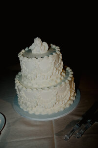 reception cake on wedding day taken by Lindsey Roman Photography, Florida based documentary wedding photographer