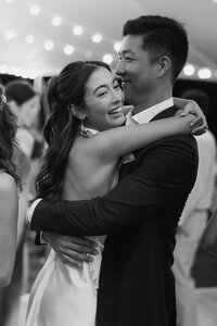 Wedding and Elopement Photographer, black and white image of couple dancing at the reception