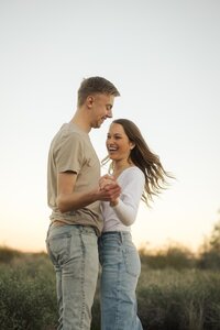 Desert engagement photos | Bride and groom dancing outside