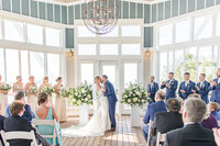 couple kissinf at wedding ceremony