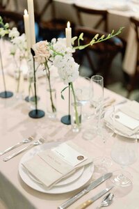 luxurious table setting with vases flowers and place settings