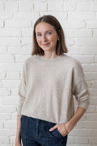 Headshot of a brand manager at an interior design firm alongside a testimonial about Erika Fitzgerald’s website copywriting services