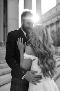 photo of bride and groom embracing taken by Upstate NY wedding photographer
