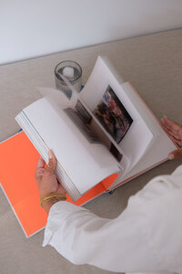A hand flipping pages of a book