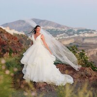 Utah Wedding Photographer captures bride standing on mountain during mountain bridals after intimate elopement ceremony