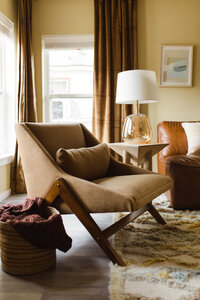 Warm toned living room with unique decor, designed by Hope Miriam Designs in DFW