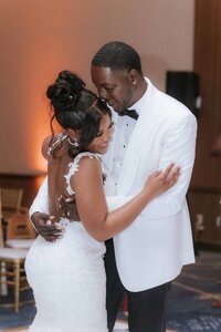 Bride and groom dancing at the reception of their wedding at the JW Marriott Bonnet Creek Resort and Spa | Photo by Phavy Photography, St. Augustine Wedding PhotographerBride and groom sunset photos at the Illume Rooftop of JW Marriott Orlando JW Marriott Bonnet Creek Resort and Spa | Photo by Phavy Photography, St. Augustine Wedding Photographer