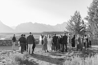 Wedding guests surround the bride and groom at Snake River Overlook in Jackson Hole Wyoming by Jackson Hole LUXURY DESTINATION wedding photographer Magnolia Tree Photo Company