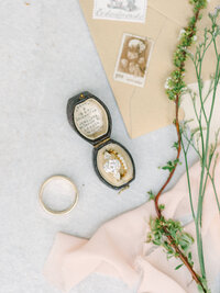 flat lay close up detail of ring in a vintage ring box