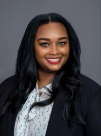 Ashlee headshot in blue blazer