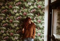 woman standing against wall
