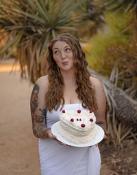 woman holding hair and looking off into the distance