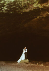 bride and groom holding eachother
