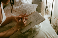 Christian woman writing her wedding vows in her wedding photos | SushDigitalMedia