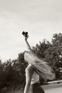 Abby Bertram poses with camera for Abby Ree Photography.