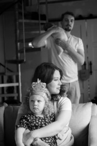 black and white portrait of a family during a home session