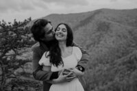 A couple embraces during their elopement at Buzzard Rock outside of Shenandoah. Shenandoah Elopement Photogorapher
