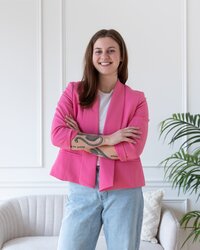 Smiling female founder revealing why she loves to do website design for small business operations