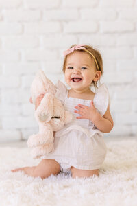 baby-portrait-with-stuffed-animal-bunny