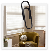 A modern chair in natural light with a paper clip over it to give it a mixed media feel.