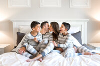 Family in Pajamas Kissing